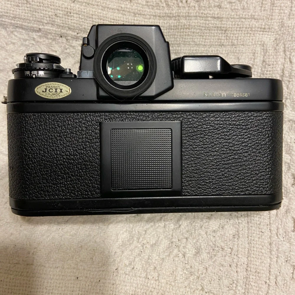 (2) Nikon F3 with Macro lens, light, zoom lens.